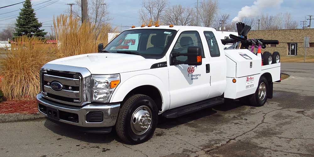 2015 Ford F350 Super Duty Extended Cab including a Miller TSV with a Holmes 220 Front Driver Side